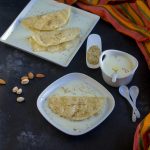 Rotimatic Paal Poli Sweetened Milk Poori Served with Two Little Spoons