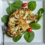Roasted Cauliflower Steak Served in Spinach Square Image