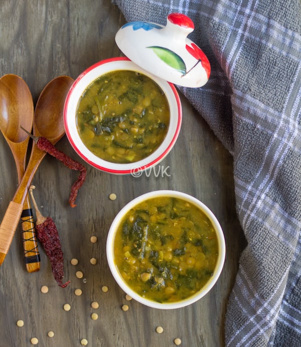 Instant Pot Green Lentils and Spinach Curry - Dal Palak - Another Great Shot of the Dish Served in Two Bowls with Two Wooden Spoons on the Left and a Greyish Cloth on the Right