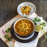 chickpeas curry with rice bowl on the top