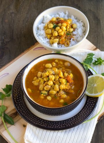 chickpeas curry with rice bowl on the top