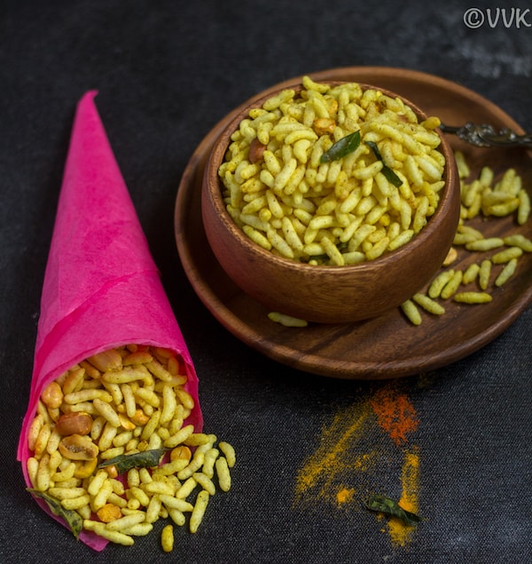 masala pori in a paper wrap and wooden bowl
