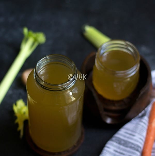close look of vegetable broth in a small jar and big jar