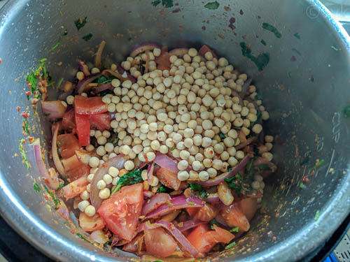 ambur veg biryani - adding peas, tomatoes