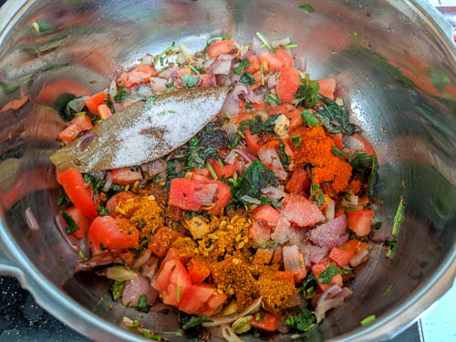 delhi biryani adding all spices