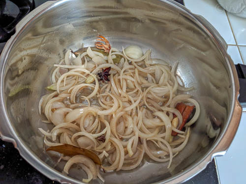 hyderabadi biryani step - adding onions