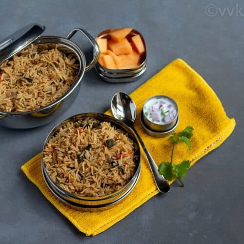 methi pulav in a lunch box with raita and fruits