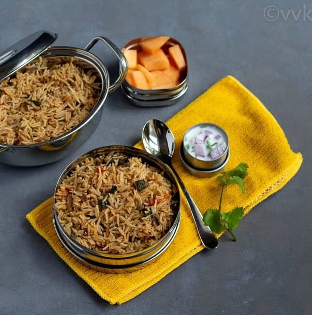 methi pulav in a lunch box with raita and fruits