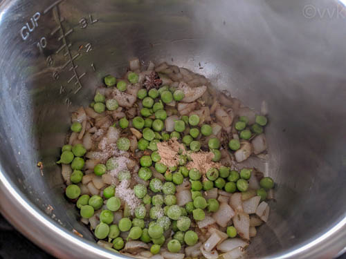 kashmiri pulav adding peas and spices