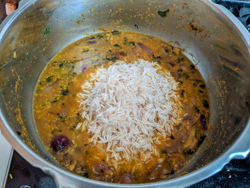 onion biryani, adding rice and water
