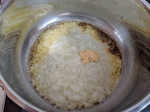 paneer makhani biryani adding onion puree