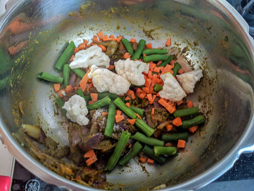 thalassery biryani adding vegetables