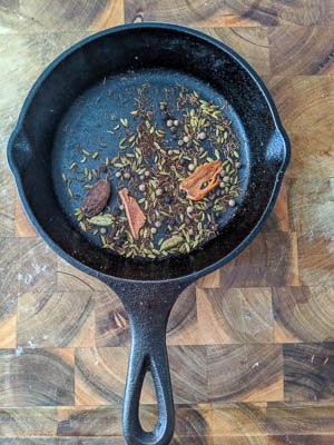 roasted spices in a cast iron pan