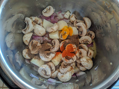 instant pot calcutta veg biryani adding potatoes, mushrooms and spices