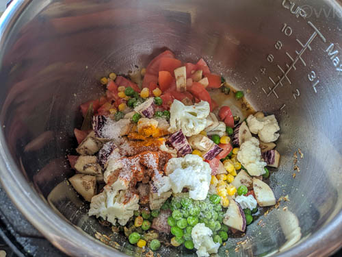 instant pot khichdi step 3 adding veggies and spices