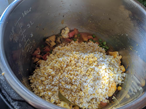 instant pot khichdi adding rice and lentils