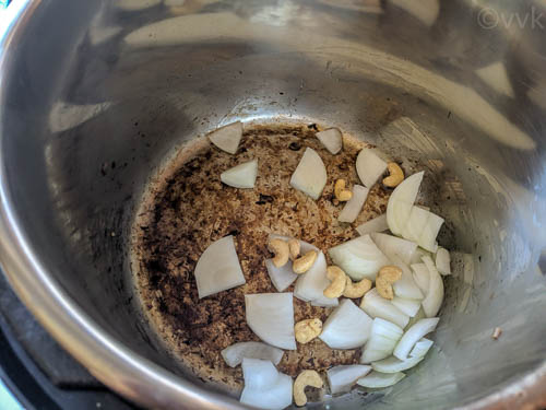 sauteing onion and cashews