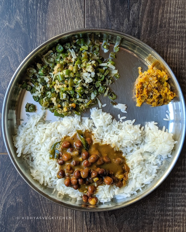 everyday cooking rice, beans curry, mango pickle and chickpeas kuzhambu