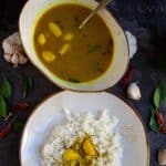 poondu kuzhambu in a white bowl and poondu kuzhambu with rice on a white plate