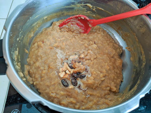 adding raisins and cashews