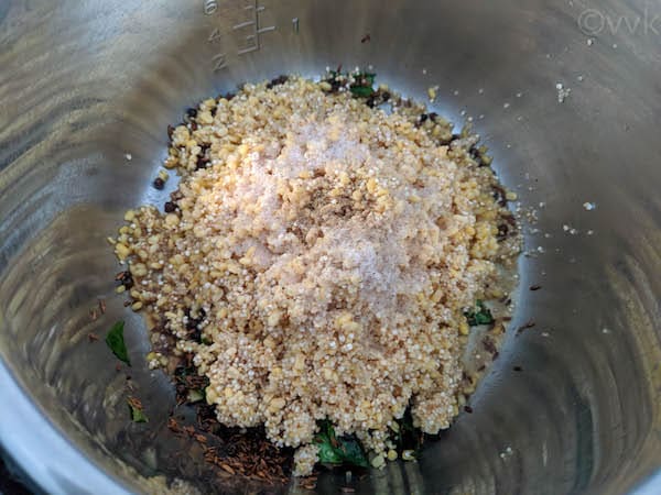 adding millet, quinoa and dal to the tempering