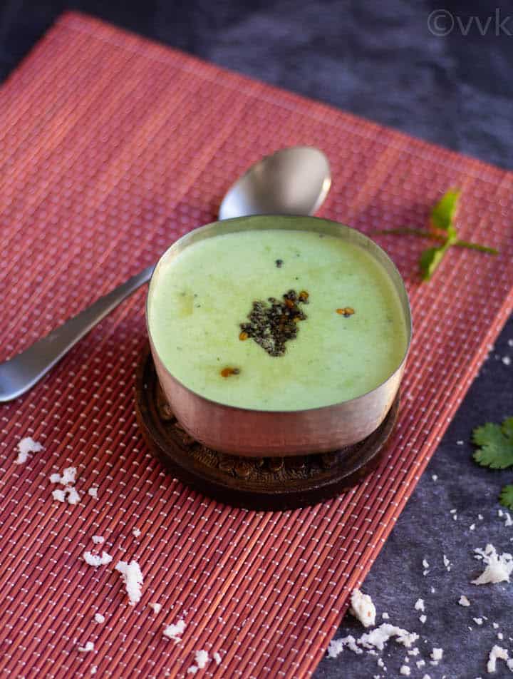coconut cilantro raita on a silverware with tempering on top