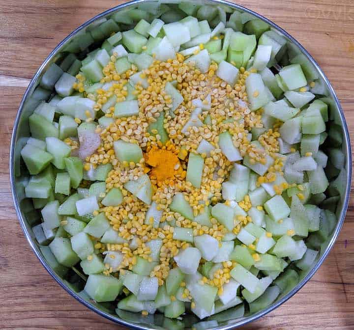 steaming chayote squash and moong dal for kootu