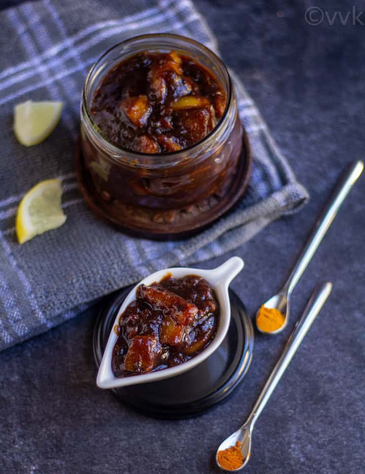 instant pot sweet and spicy lemon pickle in a glass jar and in a white cermatic bowl