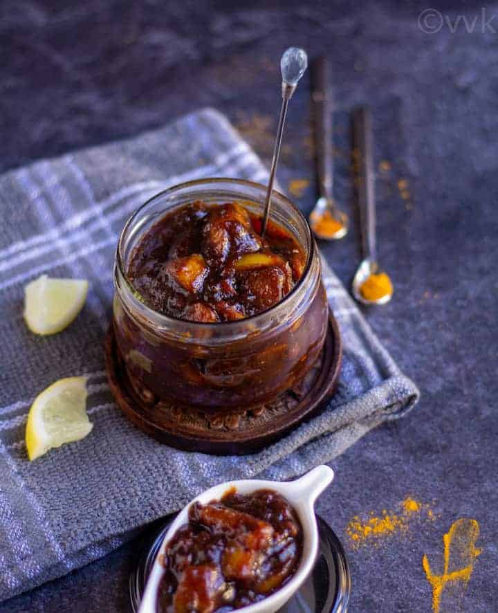 easy lemon pickle place in a glass jar with spoon on