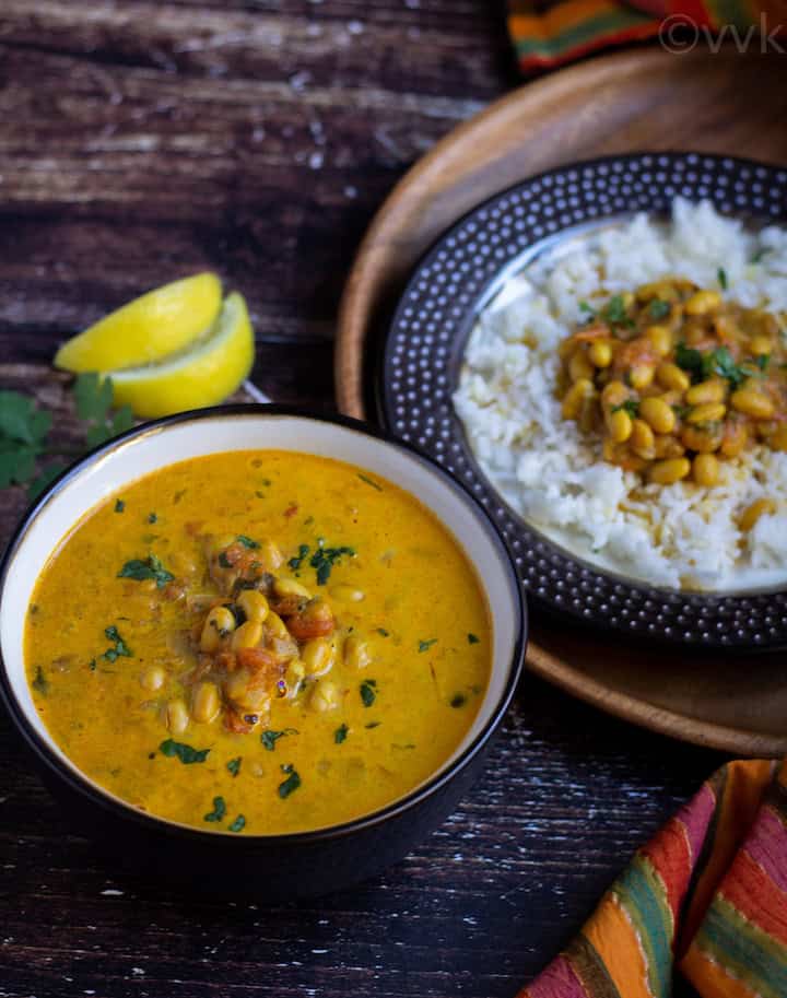 soybean curry in a bowl with rice and curry on the side