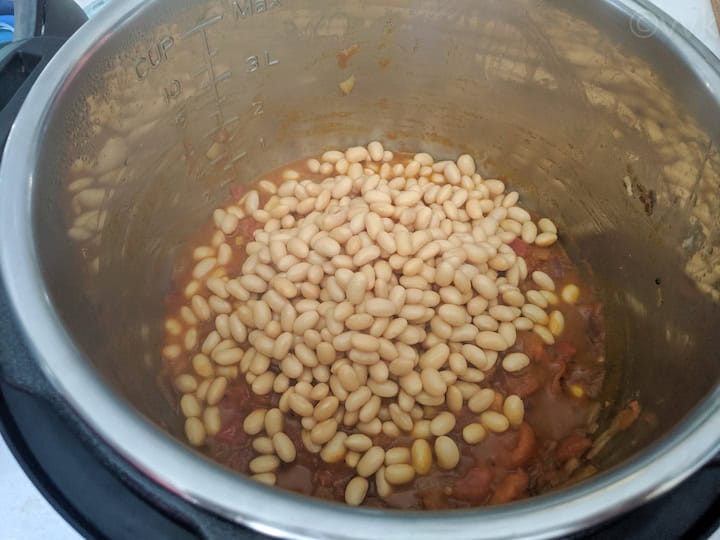 adding soaked soy beans