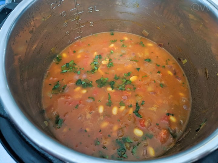 adding water and cilantro