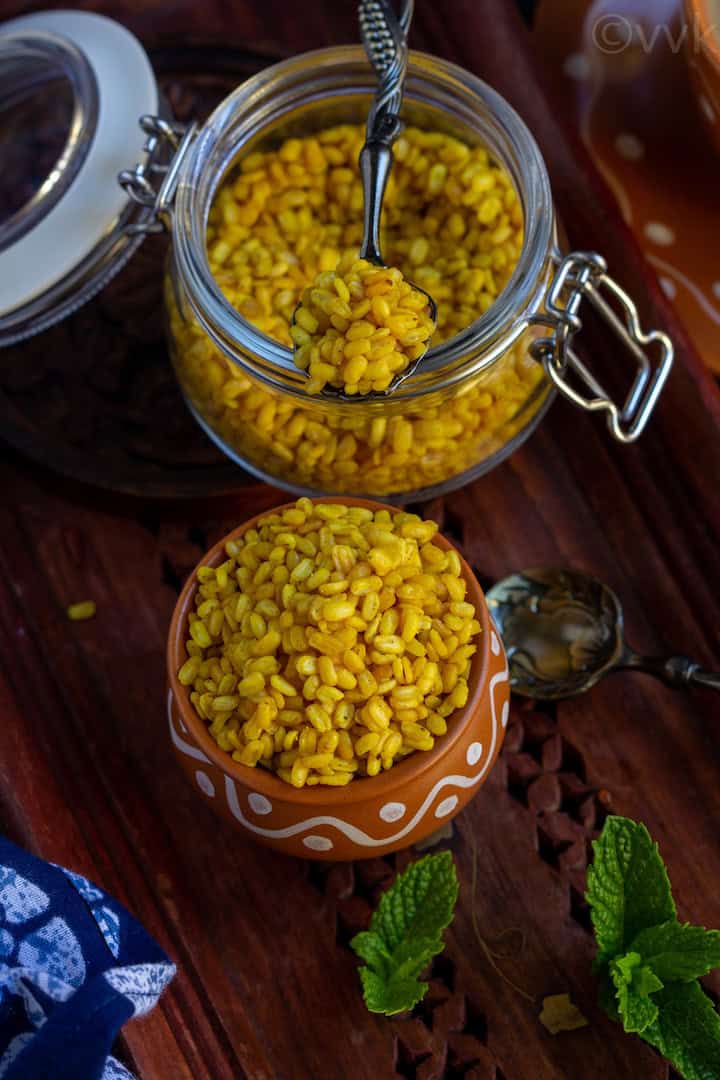 overhead shot of moong dal chaat in a kulhad cup and in a bottle