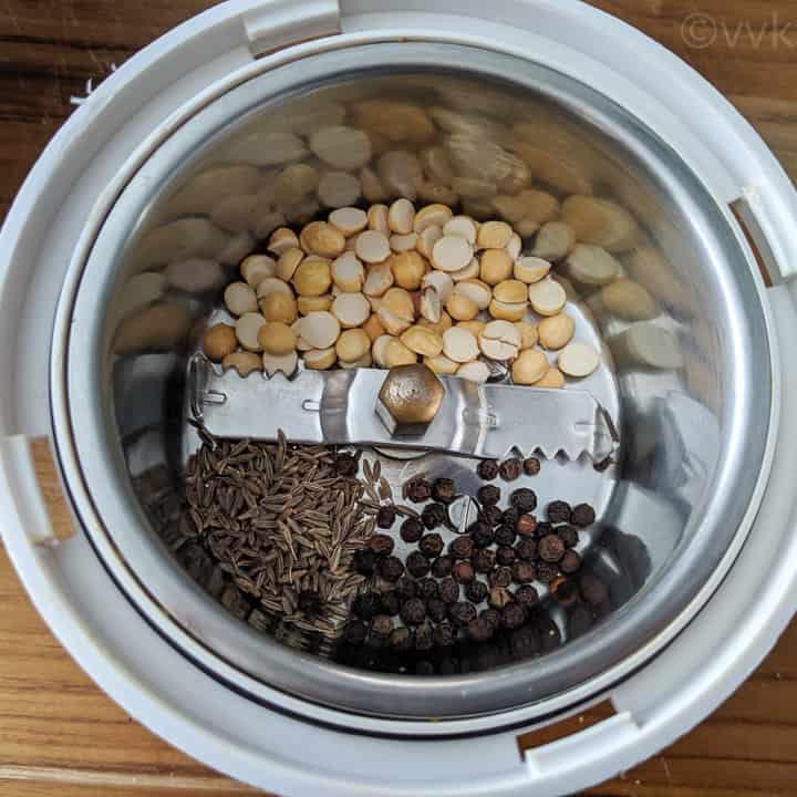 adding the kootu podi ingredients to mixer jar