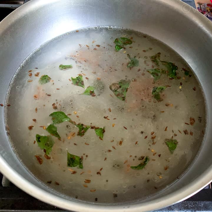 adding water to cook semiya upma