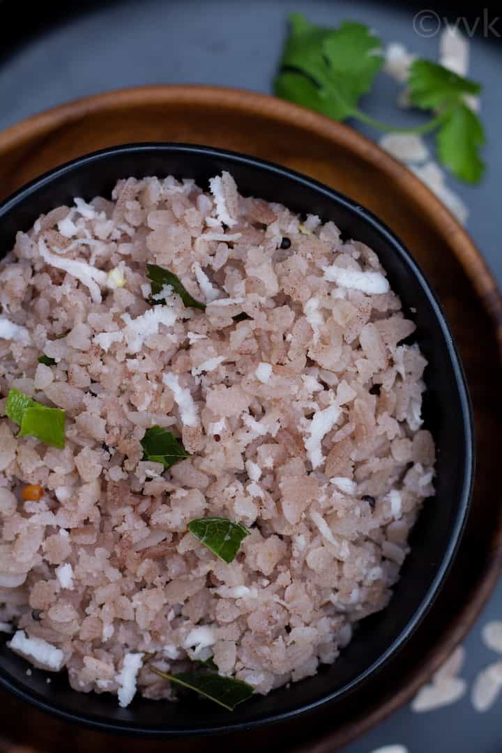 top angle close up shot of aval upma in a black bowl