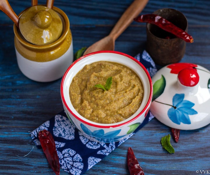 chayote squash chutney in a white bowl placed on a blue fabric