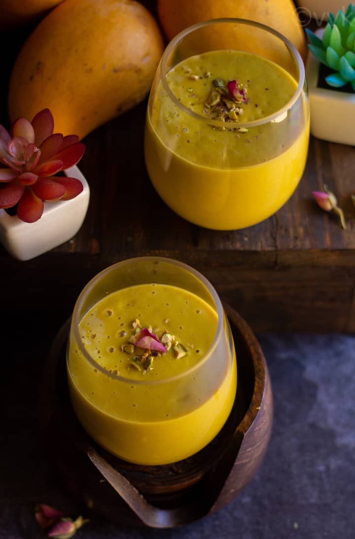 mango lassi topped with nuts and dried rose petal
