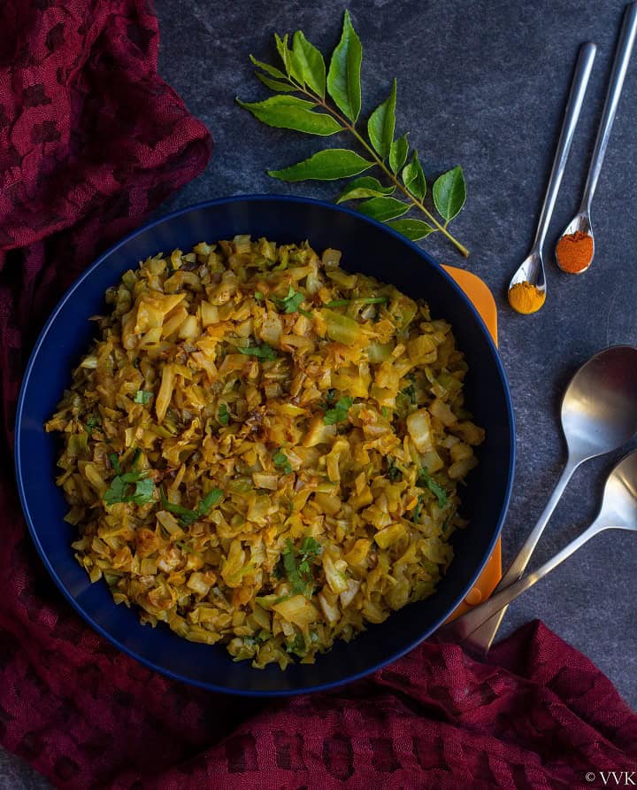 overhead shot of cabbage curry in a blue bowl