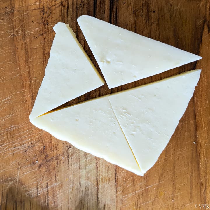 chopping the paneer in triangle shape