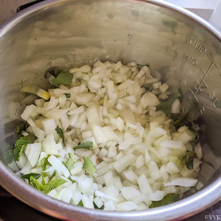 adding onion and herbs