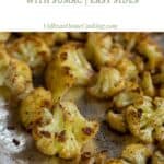 oven baked cauliflower roast in a baking tray with text overlay for pinterest