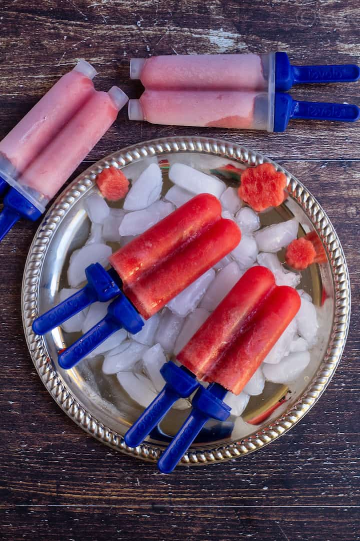 overhead shot of watermelon popsicle placed on a plate full of ice