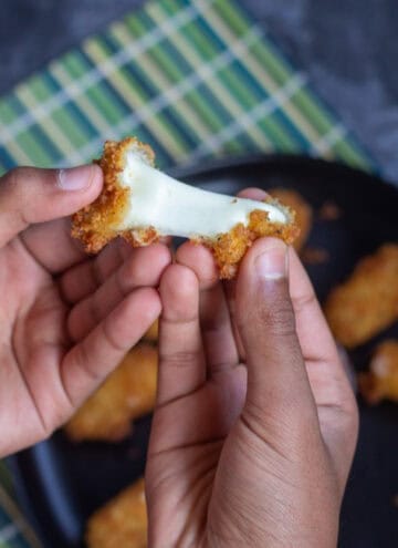 square image of fried cheese being pulled