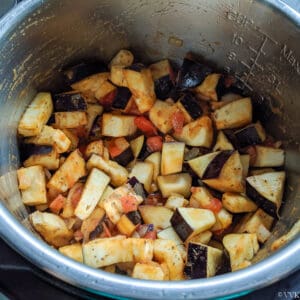 adding eggplant and pressure cooking