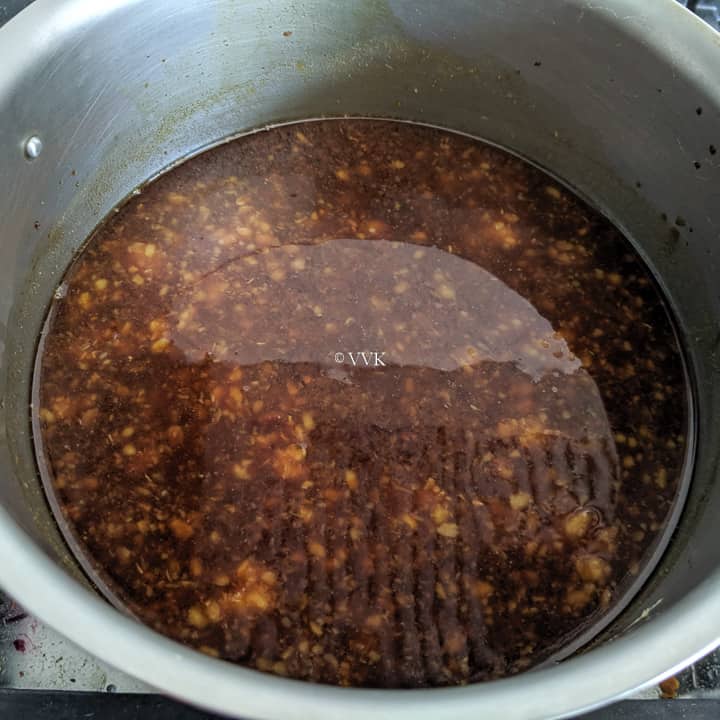 adding jaggery to the cooked moong dal
