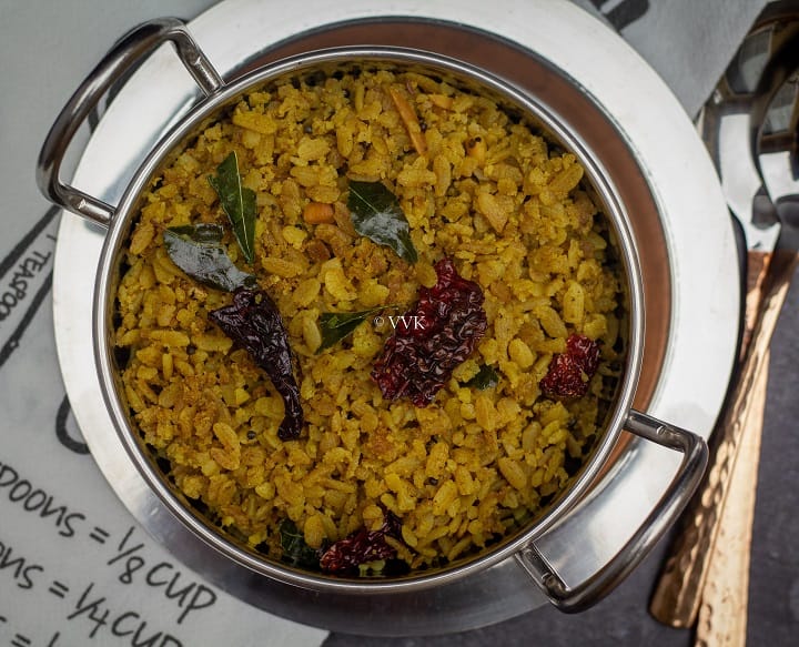 poha served in a stainless steel kadai