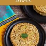 aloo paratha stacked in black plate with a cilantro leaf on the top one with text overlay for pinterest