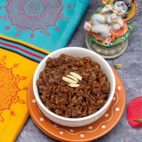 square image of sweet poha with fabric on the side and with a small idol of krishna on the top