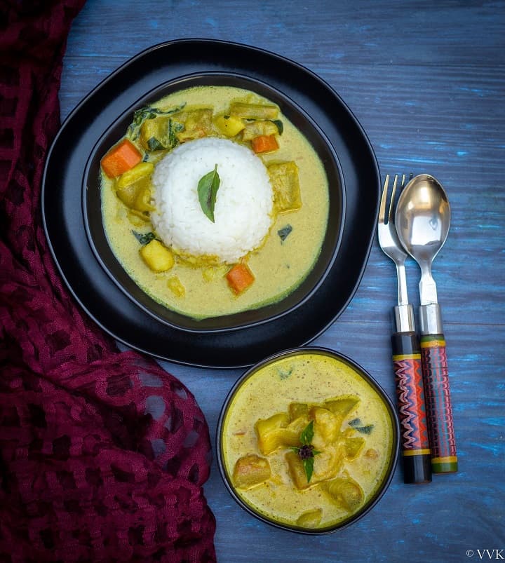 watermelon rind thai curry in a black bowl with rice and curry on a plate on the side